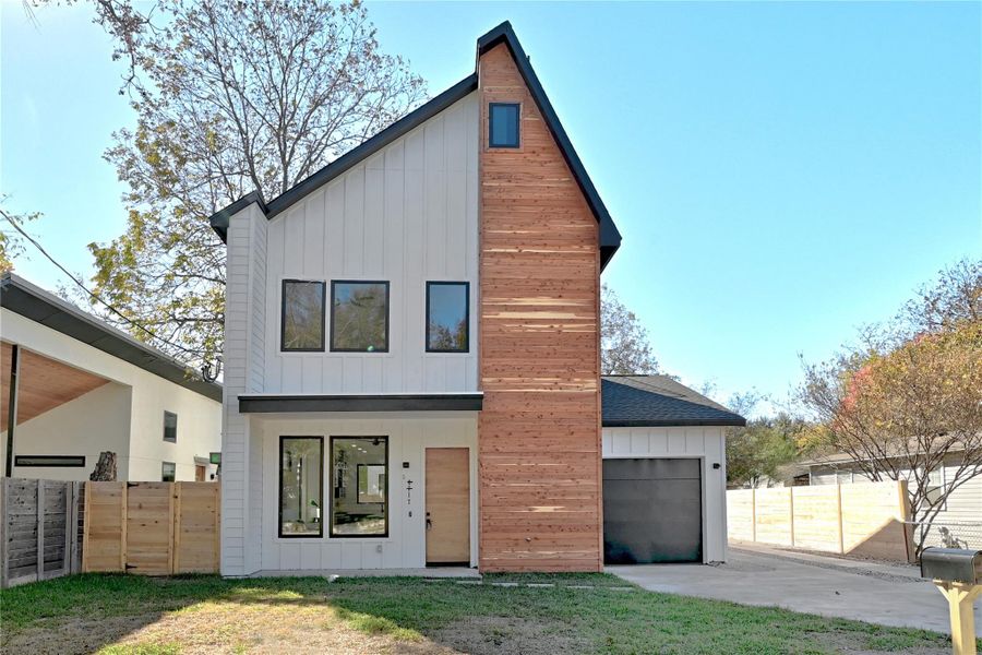 View of front facade featuring a garage