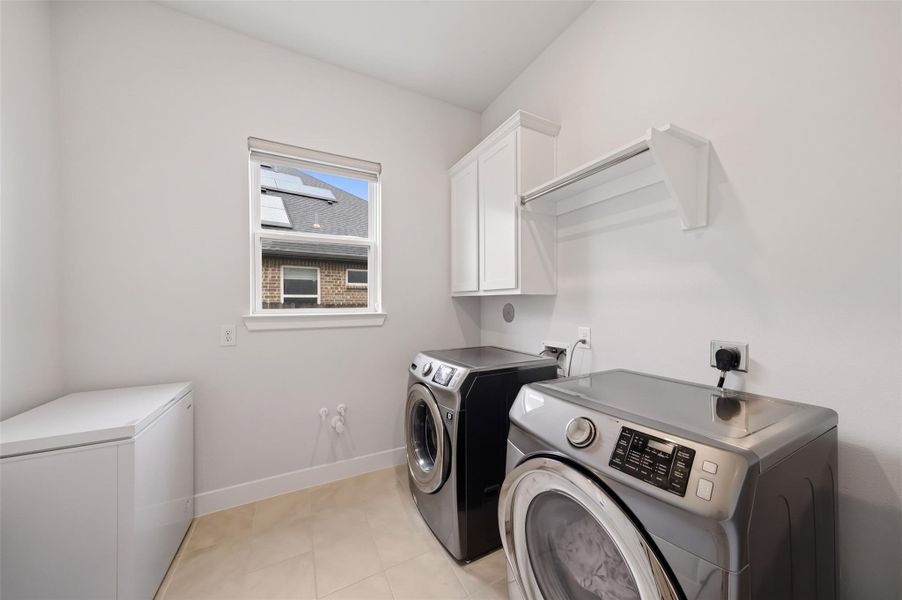 Providing direct access from the primary closet, the utility room adds an exceptional level of convenience, creating a seamless connection between dressing, storage and laundry. The washer and dryer stay with the home!