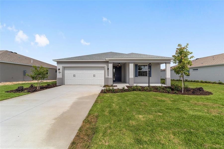 Front exterior of a new home in , Ocala, FL, highlighting curb appeal (Image 2). Front exterior of a new home in , Ocala, FL, highlighting curb appeal (Image 2).