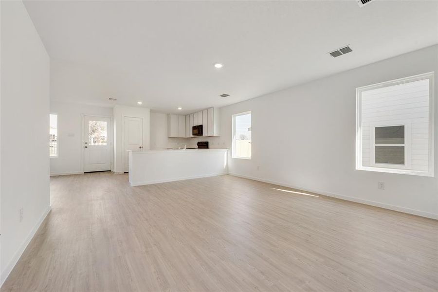 Unfurnished living room featuring light hardwood / wood-style flooring