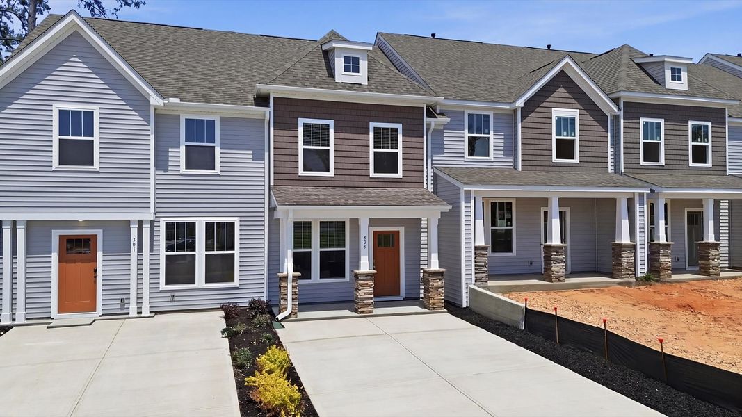 Front exterior of a new home in Clarke Townes, Anderson, SC, highlighting curb appeal (Image 2). Front exterior of a new home in Clarke Townes, Anderson, SC, highlighting curb appeal (Image 2).