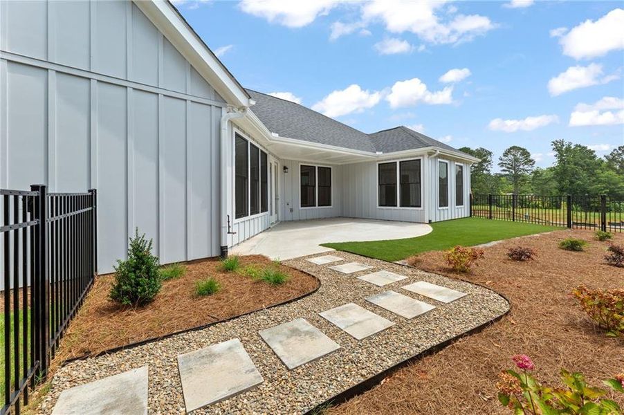 Front exterior of a new home in The Courtyards at Bailey Farm, Dacula, GA, highlighting curb appeal (Image 15).