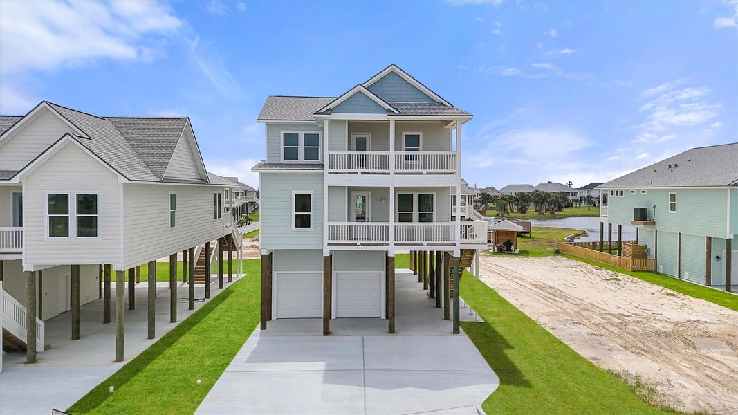 Welcome to 4042 Miramar Court — a beautifully elevated coastal home with dual garages, charming balconies, and modern curb appeal. Welcome to 4042 Miramar Court — a beautifully elevated coastal home with dual garages, charming balconies, and modern curb appeal.