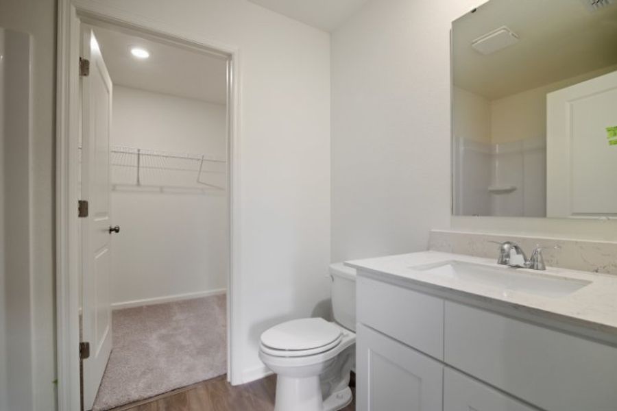 A bathroom with a sink toilet and shower.