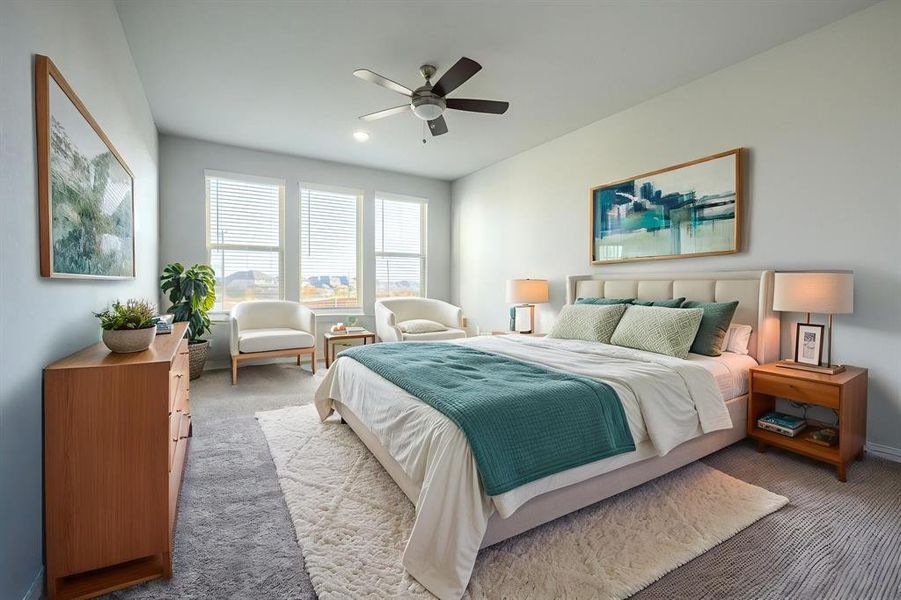 Carpeted bedroom with ceiling fan and baseboards Carpeted bedroom with ceiling fan and baseboards