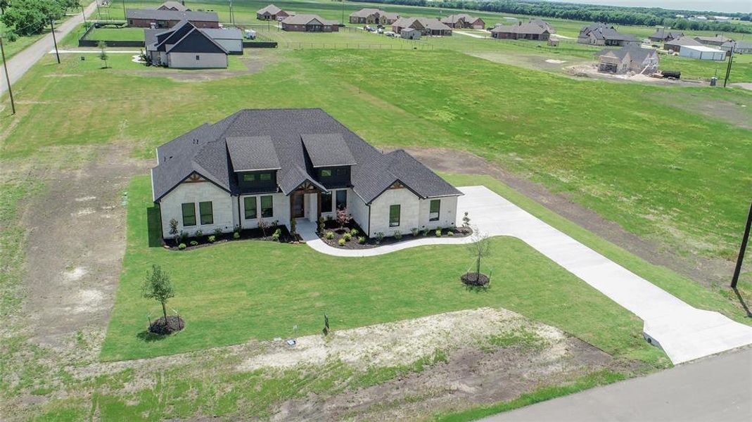 Front exterior of a new home in , Celeste, TX, highlighting curb appeal (Image 24).