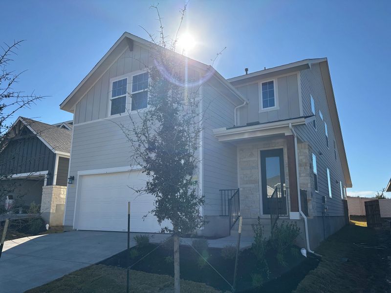 Front exterior of a new home in Cannon Ranch 40s, Dripping Springs, TX, highlighting curb appeal (Image 20).