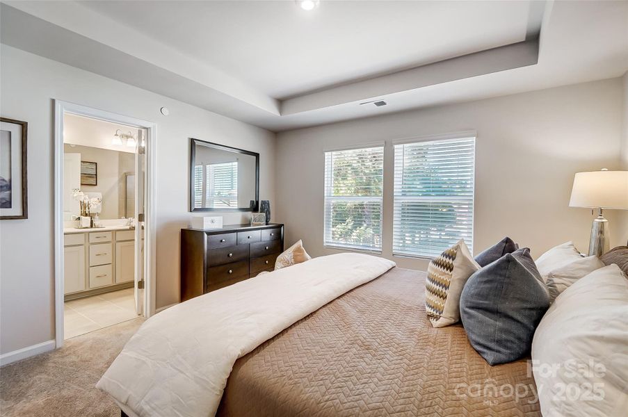 Primary Suite with View to Primary Bathroom-Photo Similar to Subject Property Primary Suite with View to Primary Bathroom-Photo Similar to Subject Property