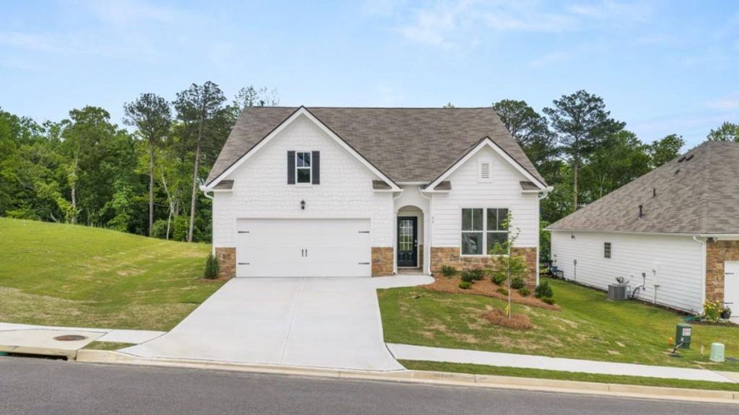 Front exterior of a new home in Lost Creek, Dallas, GA, highlighting curb appeal (Image 2). Front exterior of a new home in Lost Creek, Dallas, GA, highlighting curb appeal (Image 2).