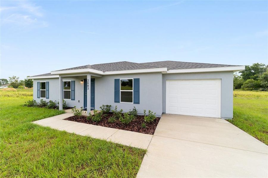 Front exterior of a new home in , Ocala, FL, highlighting curb appeal (Image 21). Front exterior of a new home in , Ocala, FL, highlighting curb appeal (Image 21).