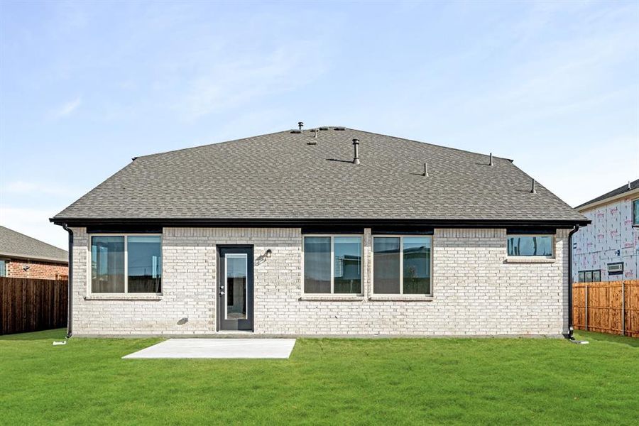 Exterior details and patio area of a home in East Oak Creek Elements, Commerce (Image 21).