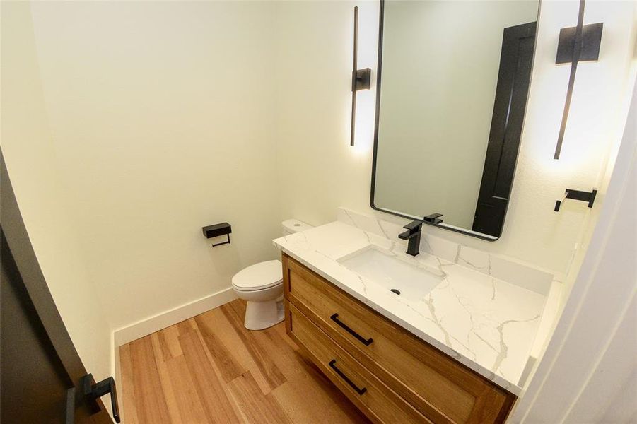 Guest bathroom with white oak floating vanity.