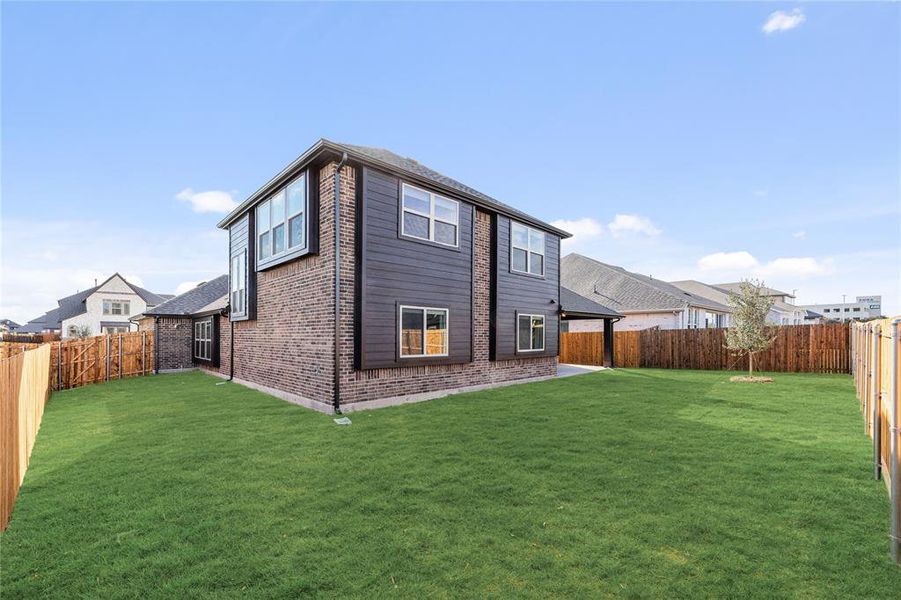 Exterior details and patio area of a home in West Crossing, Anna (Image 26). Exterior details and patio area of a home in West Crossing, Anna (Image 26).
