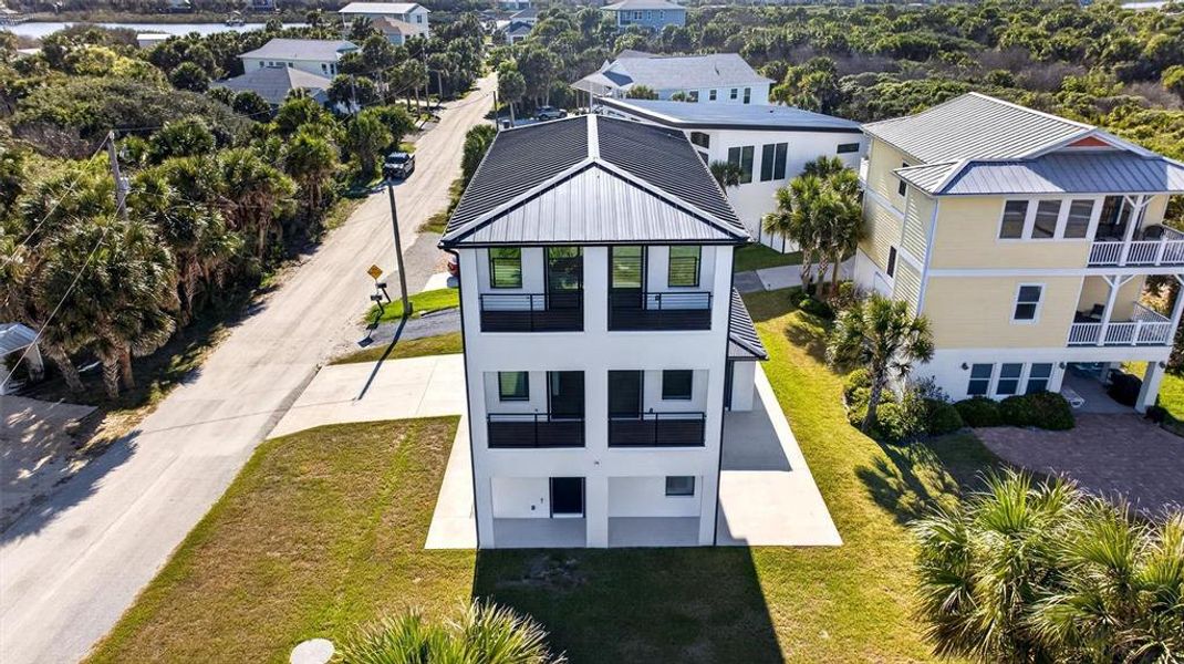 Front exterior of a new home in , Flagler Beach, FL, highlighting curb appeal (Image 28).