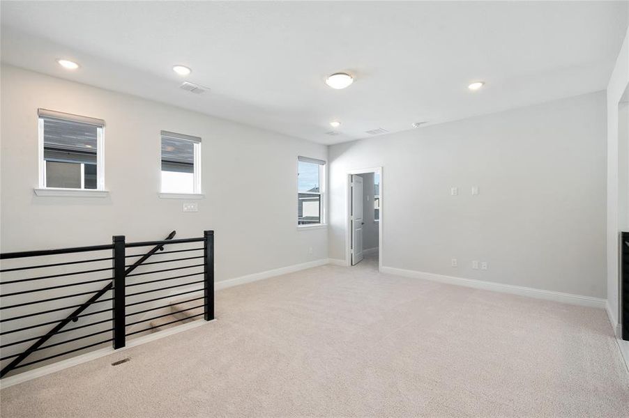 3rd bedroom with ensuite bath off upstairs living area.