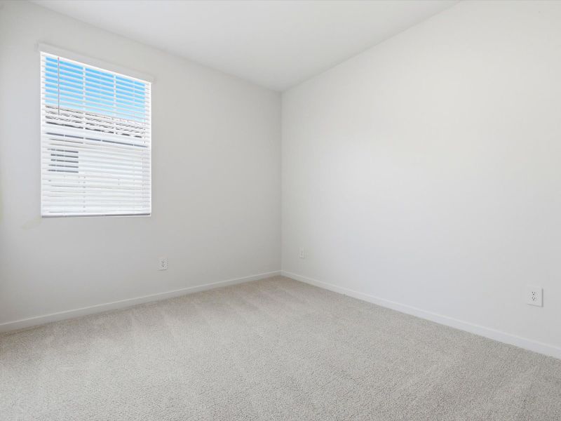 Spacious, unfurnished interior of a new home in Blossom Rock Reserve Series, Apache Junction (Image 18).