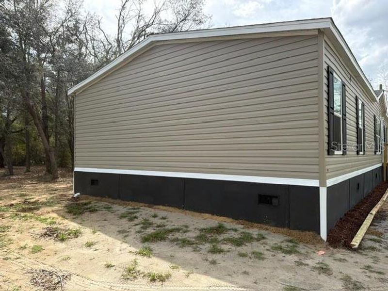 Exterior details and patio area of a home in , Bronson (Image 22).
