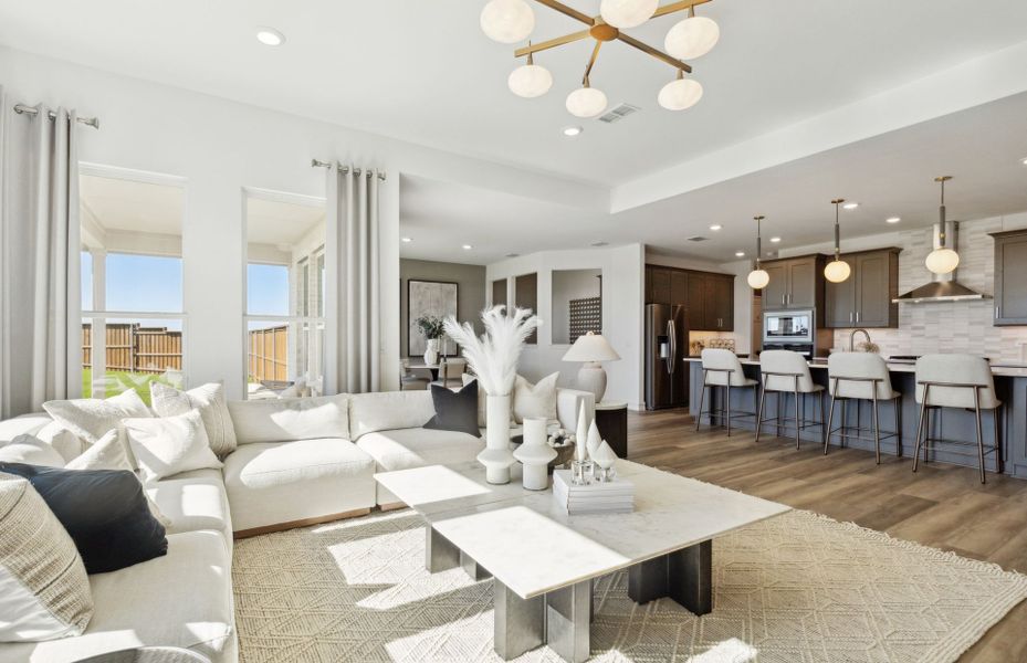 Spacious gathering room with view of kitchen