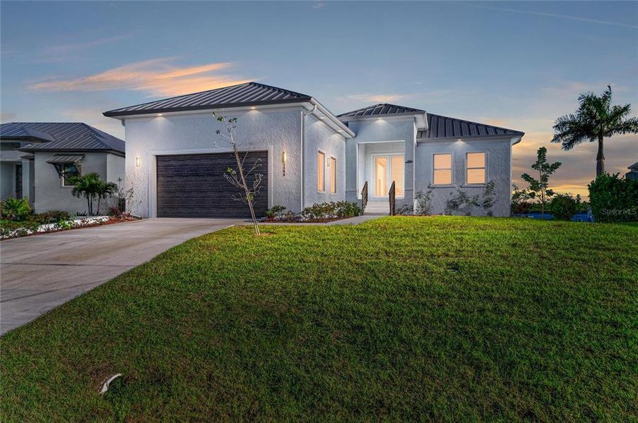 Front exterior of a new home in , Punta Gorda, FL, highlighting curb appeal (Image 2).