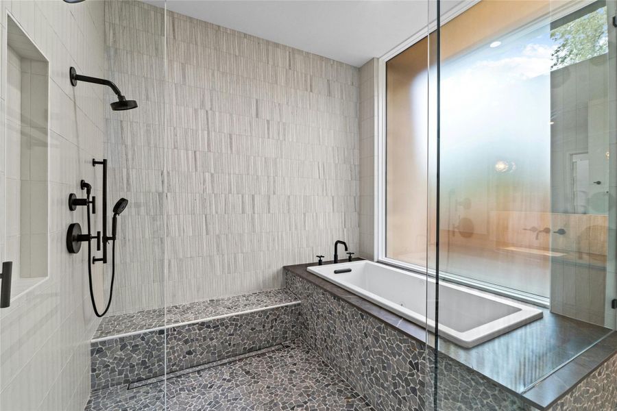 Master tub is jetted and located in the shower enclosure. Step out of bath bubbles and into the shower. Perfect ritual.