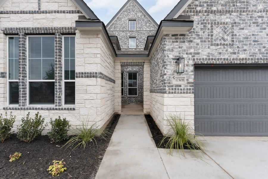 Exterior details and patio area of a home in The Grove at Blackhawk, Pflugerville (Image 19).