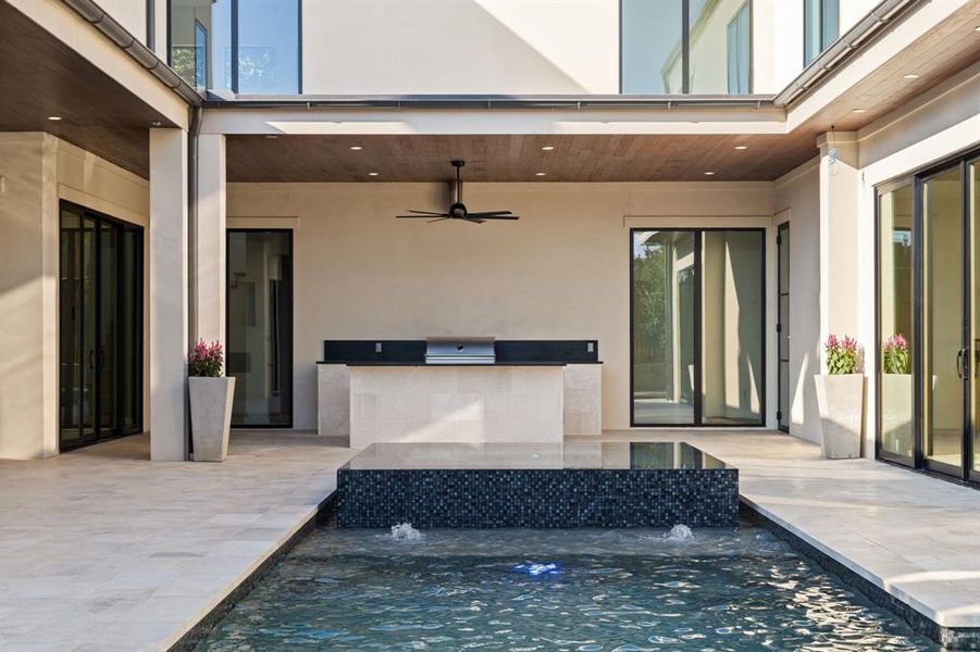 View of patio / terrace with ceiling fan, area for grilling, and an outdoor pool View of patio / terrace with ceiling fan, area for grilling, and an outdoor pool