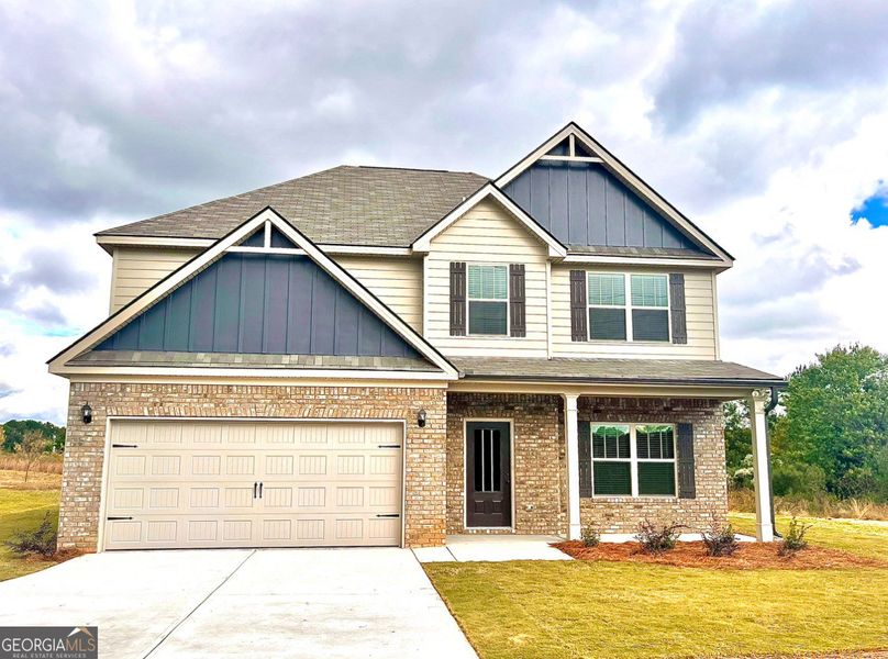 Front exterior of a new home in McIntosh Road, Griffin, GA, highlighting curb appeal (Image 1).