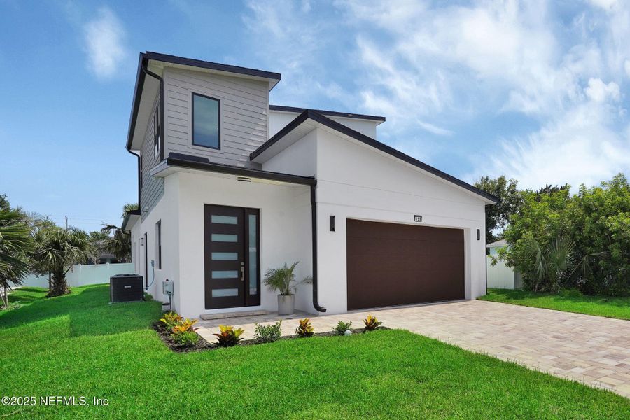Front exterior of a new home in , Ormond Beach, FL, highlighting curb appeal (Image 23).