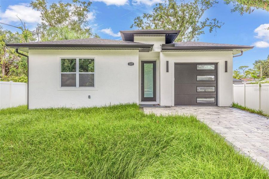 Front exterior of a new home in , Tampa, FL, highlighting curb appeal (Image 27).