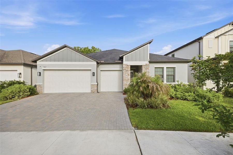 Front exterior of a new home in , Land O' Lakes, FL, highlighting curb appeal (Image 27).
