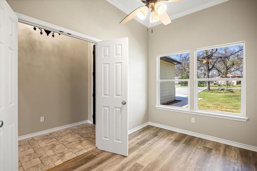 4403 N. Port Ridglea Ct. Granbury,TX 76049 Office or baby nursery room featuring crown molding, a ceiling fan, and light wood finished floors