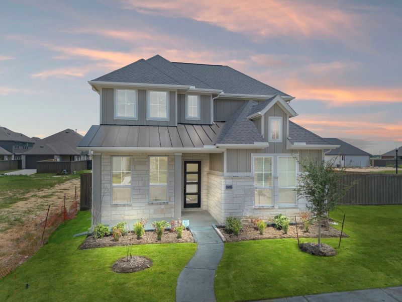 Front exterior of a new home in Riceland, Mont Belvieu, TX, highlighting curb appeal (Image 24).
