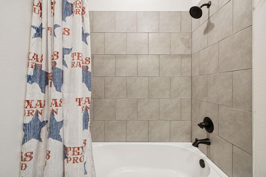 Bathroom with shower / tub combo Bathroom with shower / tub combo