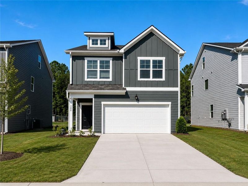 Front exterior of a new home in Walden Park – The Retreat, Lithonia, GA, highlighting curb appeal (Image 1). Front exterior of a new home in Walden Park – The Retreat, Lithonia, GA, highlighting curb appeal (Image 1).