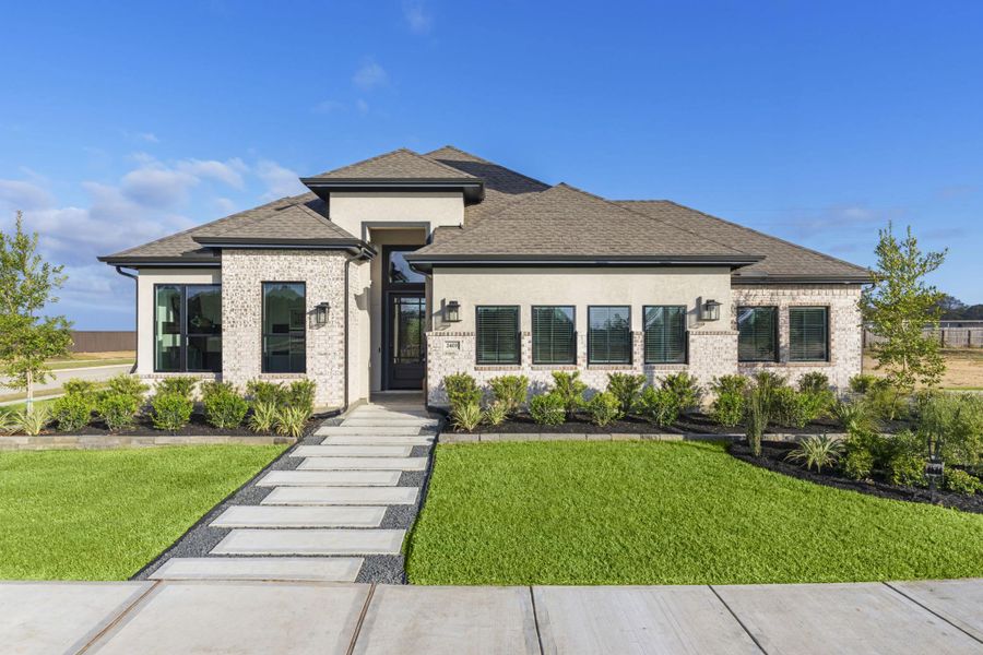 Representative exterior photo of a completed home built from the Lauren by Chesmar Homes in Wood Leaf Reserve, Tomball, TX (Image 20).