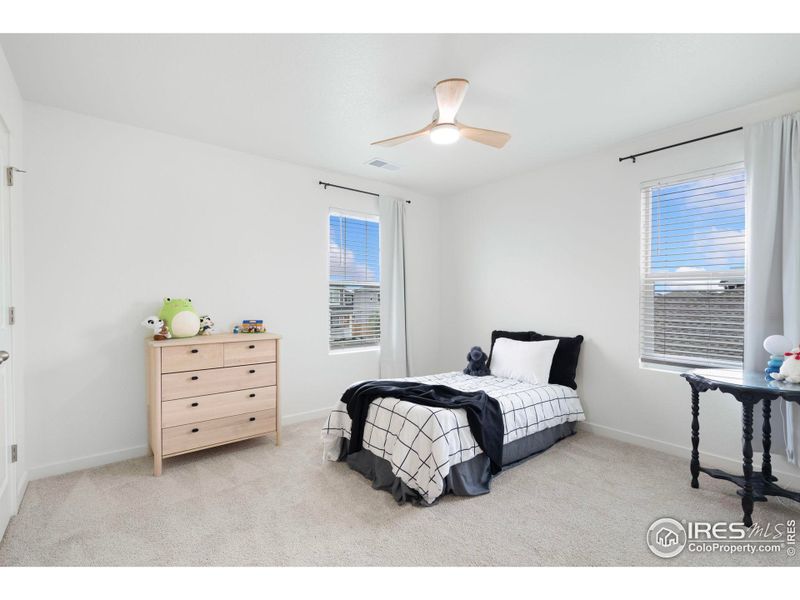 One of the two additional bedrooms on the upstairs level. One of the two additional bedrooms on the upstairs level.