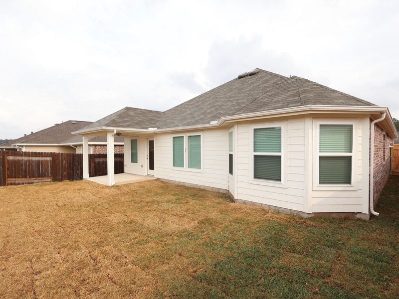 Exterior details and patio area of a home in Magnolia Ridge, Magnolia (Image 3).