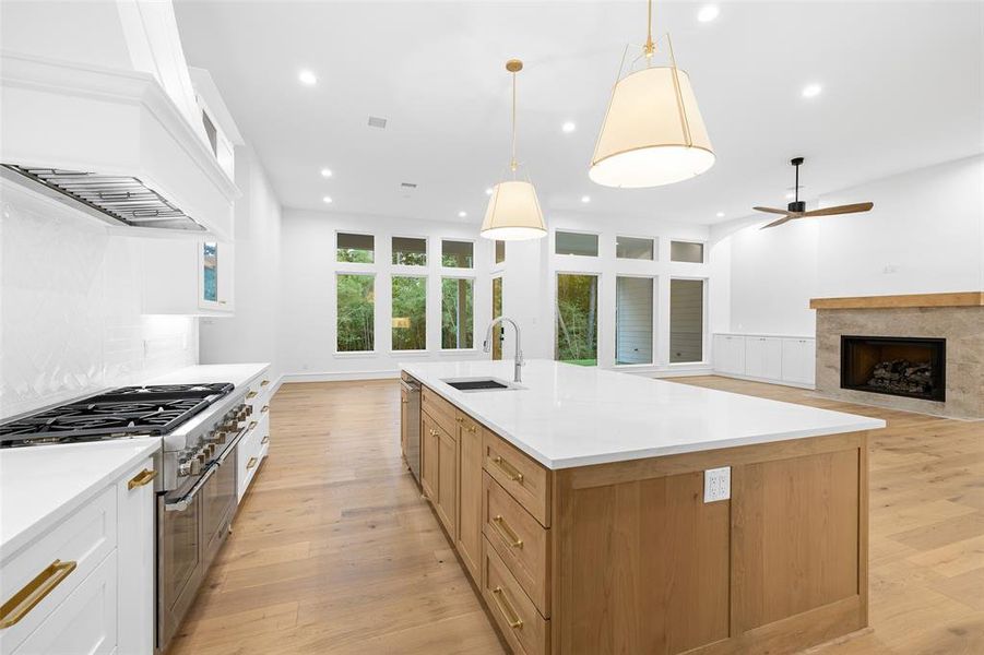 Custom cabinetry, custom hood, soft close doors and drawers, under cabinet lighting and quartz countertops, this kitchen will not disappoint.