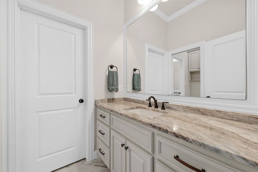 Jack and Jill bathroom with granite countertops, and separate vanity areas. Jack and Jill bathroom with granite countertops, and separate vanity areas.