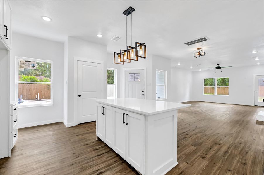 Quartz countertops, stainless steel appliances, and pendant lighting. Quartz countertops, stainless steel appliances, and pendant lighting.