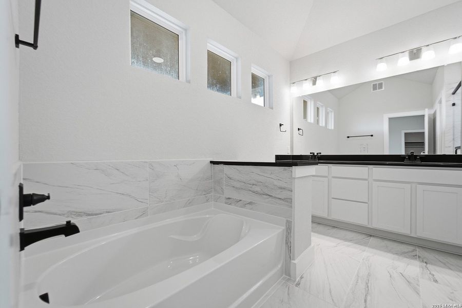Furnished interior view inside a new home in The Woodlands at Medina Hills, Mico (Image 11).