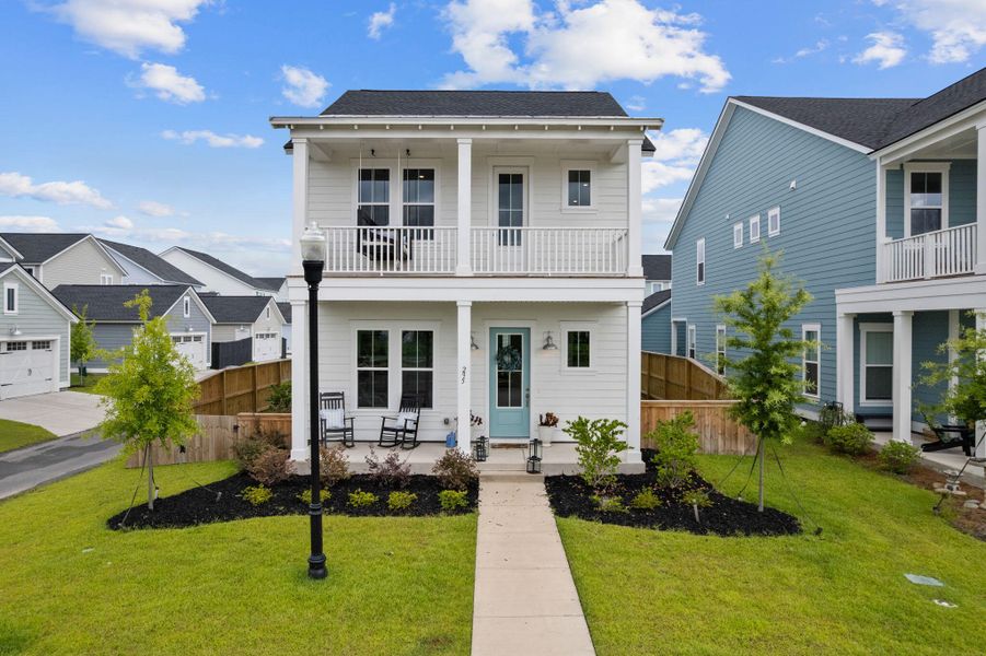 Front exterior of a new home in Carnes Crossroads, Summerville, SC, highlighting curb appeal (Image 2). Front exterior of a new home in Carnes Crossroads, Summerville, SC, highlighting curb appeal (Image 2).