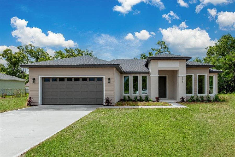 Front exterior of a new home in , North Port, FL, highlighting curb appeal (Image 18).