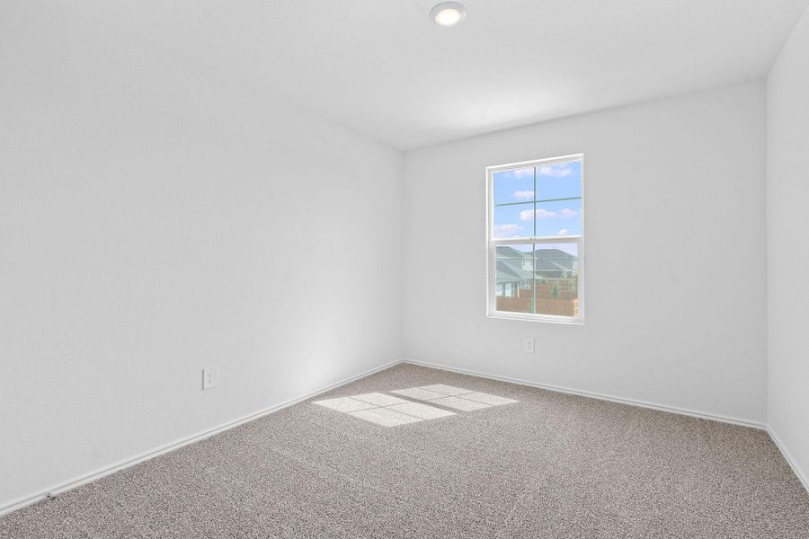 Carpeted spare room with baseboards Carpeted spare room with baseboards