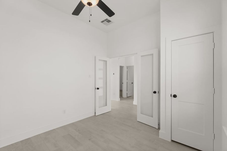 Representative unfurnished interior of a home built from the Pinehurst by Chesmar Homes in Riceland Alley Loads, Mont Belvieu (Image 13).