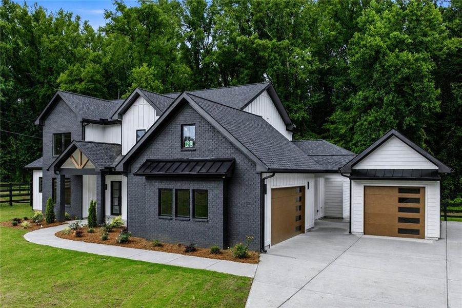 Front exterior of a new home in , Cumming, GA, highlighting curb appeal (Image 29).