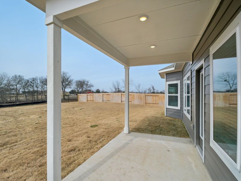Exterior details and patio area of a home in Riverbend at Double Eagle - Boulevard Collection, Cedar Creek (Image 2). Exterior details and patio area of a home in Riverbend at Double Eagle - Boulevard Collection, Cedar Creek (Image 2).