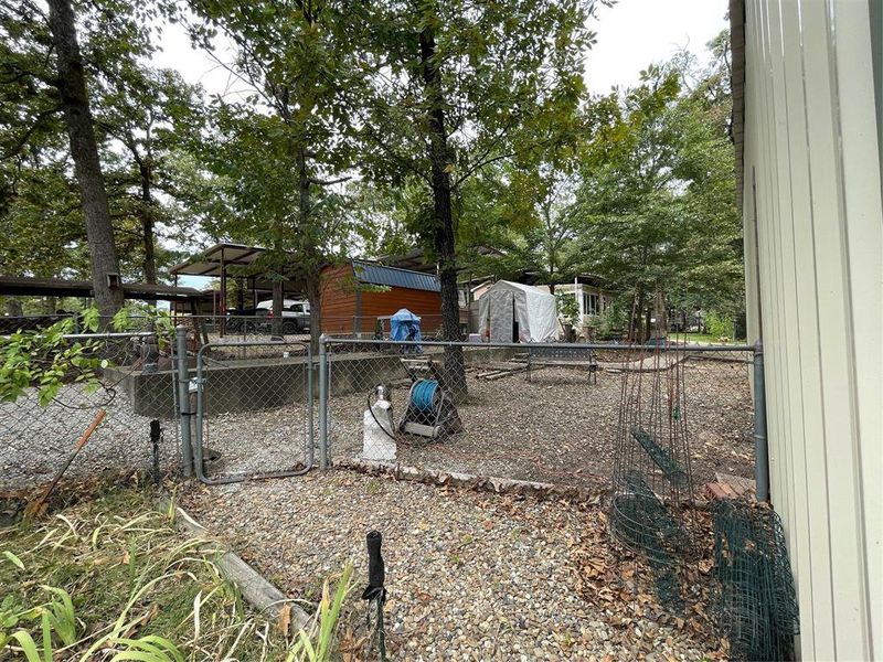View of yard featuring a storage unit View of yard featuring a storage unit