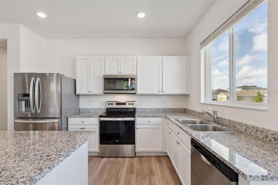 Furnished interior view inside a new home in , Mascotte (Image 43).