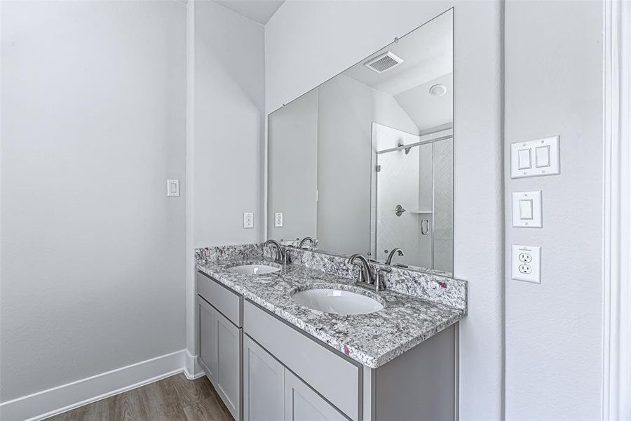 Primary Bath has a double vanity, soaking tub & walk in shower